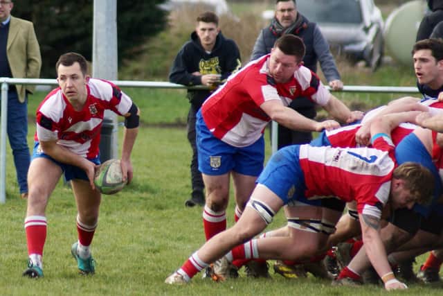 Action from Wellingborough's victory at Bourne, which saw them crowned as champions