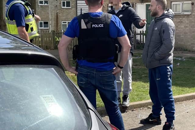 Lee Annand (right) being spoken to by Operation Pacify officers earlier this year