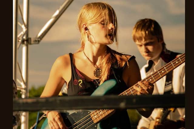 Liv West performing with Tiebreak.