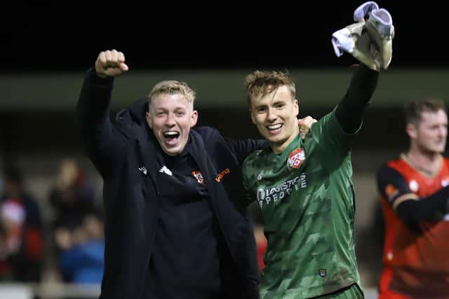 Harrison Foulkes, pictured with goalkeeper coach Harry Hogg, is back on loan at Kettering Town from Derby County. Picture by Peter Short