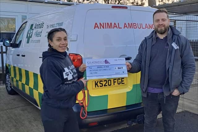 The cheque from Gladwells Pet & Country Store in Rushden being presented to Animals In Need