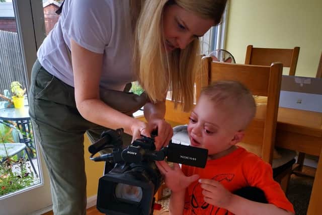 Sebastian discusses the camera with the Anglia TV crew