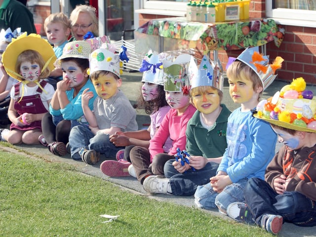 Children at Acorn Day Nursey, Burton Latimer, show off their bonnets 2003