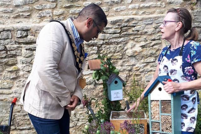 Jackie Bestwick, winner of the wheelbarrow competition chats to new Mayor Cllr. Vijay Paul