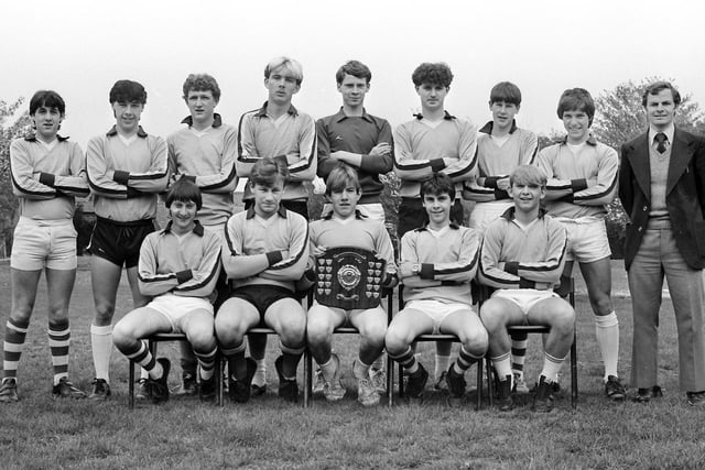 1984 a youth football team all smiles with a trophy