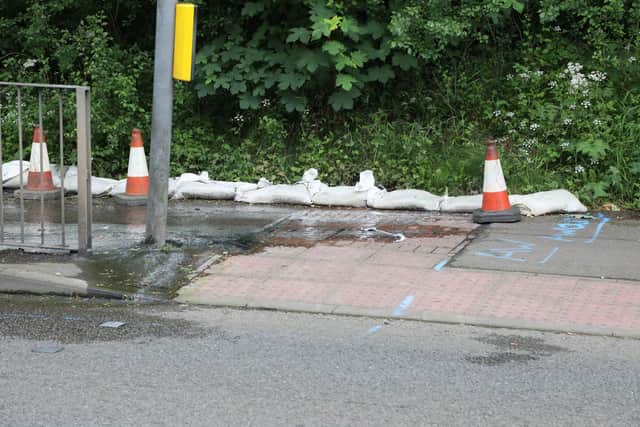 Sewer pipe water on the pavement used by many to get to Kettering General Hospital