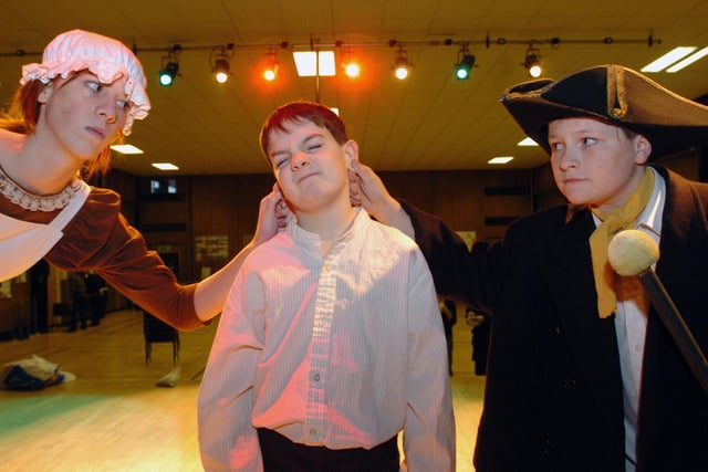 Actors in the 2006 production of 'Oliver'. Pictured are Widow Corney (Rochelle Alexander) Oliver (Alistair Melville) and Mr Bumble (Ross Ferguson).