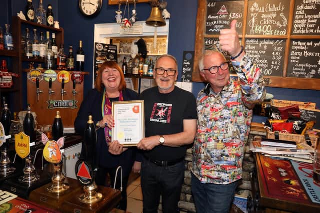 L-r Landlady Tracie Clarke-Piggot , Bernie Peal (CAMRA Northants chairman) and Alan Piggot