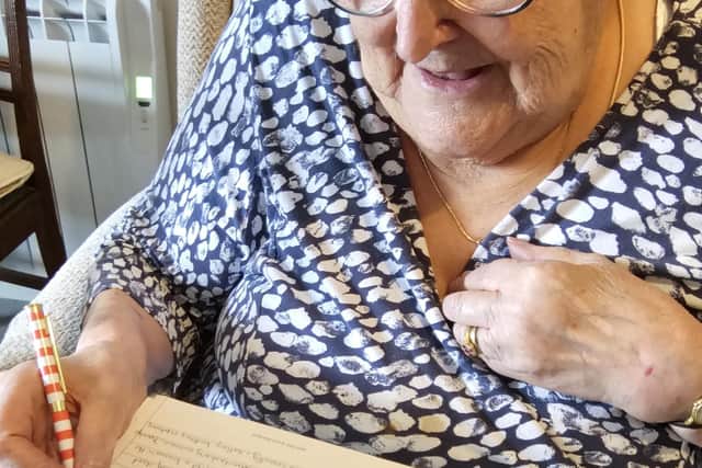 Jenny Nixon, 90, of Rushden putting pen to paper for her life story
