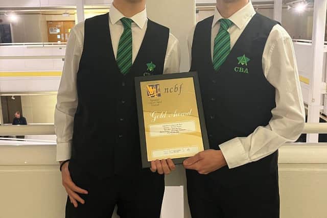 Year 13 twins Vlad and Denis Musat proudly display Corby Business Academy’s Gold Award certificate following the band’s success at the National Concert Band Festival.