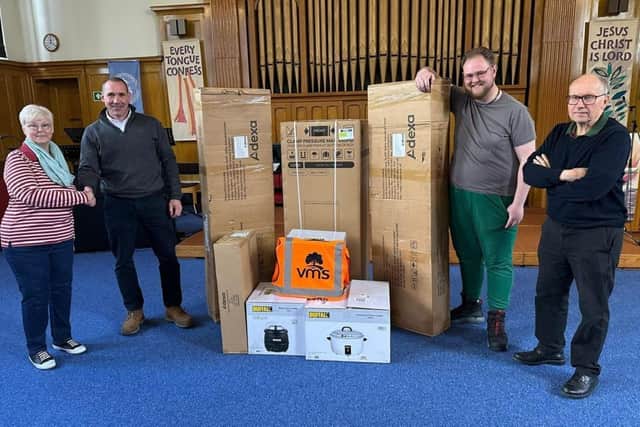 Pictured (L-R) are Vanessa Taylor-Griffiths, co-ordinator at Central Methodist Food Kitchen, Kev Garfield, head of business support at VMS Ltd, and volunteers Dakota Sloan and Jon Waterfield