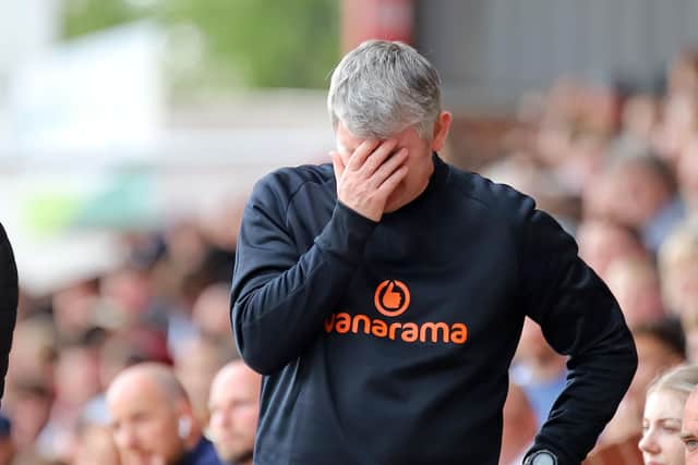 Lee Glover's reaction tells the story as his Kettering Town team were relegated on the final day of the Vanarama National League North season. Pictures by Peter Short