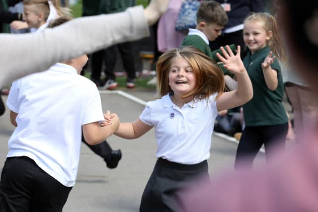 Dance down the Decades performed by children from Corby Old Village Primary School