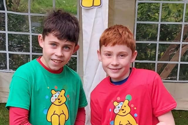 Brothers Harry, 11, and Archie, nine after completing their challenge
