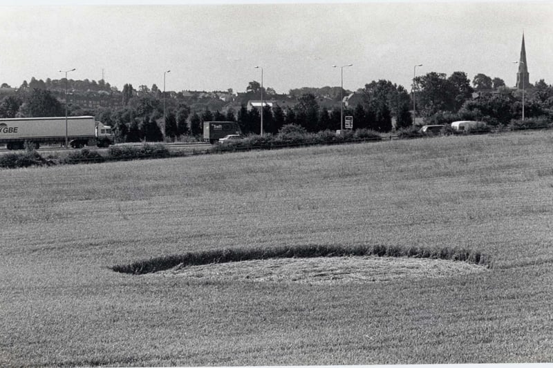 A design off the A45. Irchester church can be seen in the background. It's from July 30, 1993.