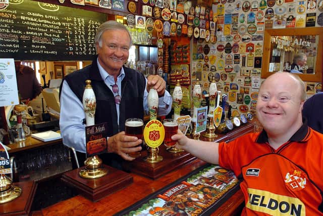 Retro: Former Kettering Town FC manager Ron Atkinson, pulls a pint celebrating the 135th anniversary of Kettering Town    l-r Ron Atkinson and Poppies fan Shaun Hickman. April 2007