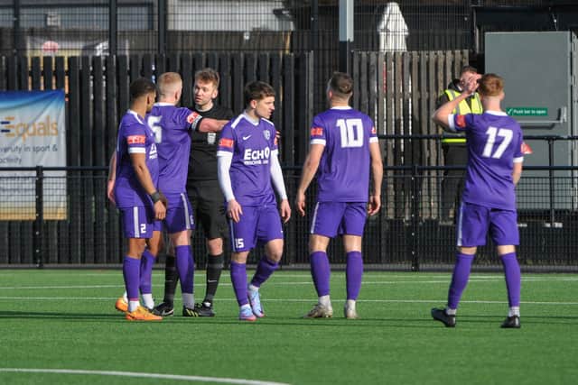 The Corby Town players let their feelings known to the referee after Sporting Khalsa's controversial fourth goal in their 4-1 defeat. Pictures by Jim Darrah
