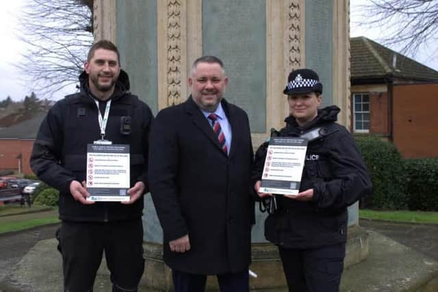 Leigh Goodwin (right) with signage of the PSPO implemented in Rushden in March 2024
