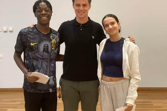Mr M Jackson, Head of year 11 with two of our top achievers, Emily Bolland and Richard FajimniFaj