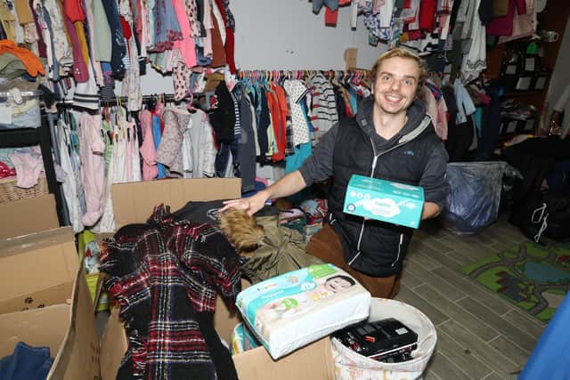 Volunteer Callum Still packing some of the boxes