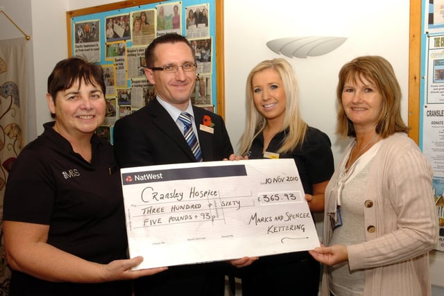 Kettering: Cheque presentation to Cransley Hospice from Marks & Spencer - Debbie Grant (right) Cransley Hospice fund raiser receives the cheque from June Ryan, Mark Freer, (store manager) and Tania Wills.