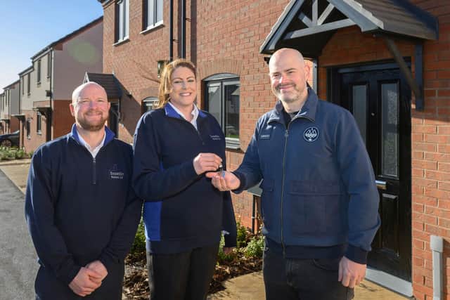 Colleagues from Snowdon Homes hand over the keys to the final properties at Gold Street in Desborough to Mike Lowe, Amplius Project Manager.