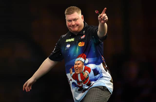 Ricky Evans celebrates a set win in his demolition of world number six Nathan Aspinall on Saturday (Photo by Paul Harding/Getty Images)
