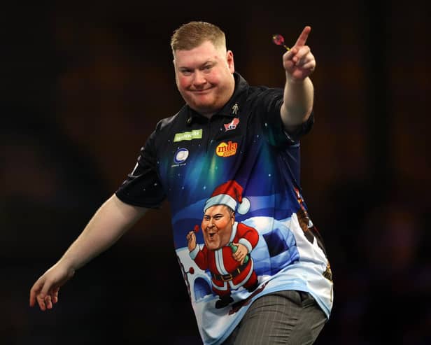 Ricky Evans celebrates a set win in his demolition of world number six Nathan Aspinall on Saturday (Photo by Paul Harding/Getty Images)