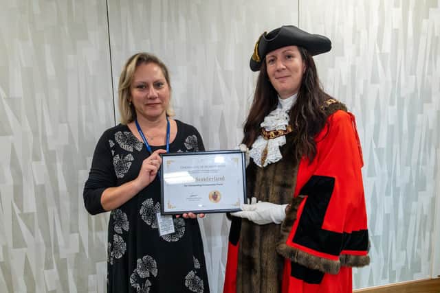 Sergeant Dina Sunderland (left) with Corby mayor, Cllr Leanne Buckingham (right)