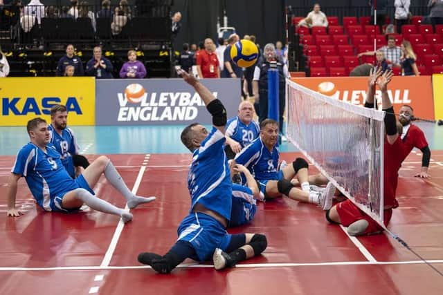 A sitting volleyball match in progress