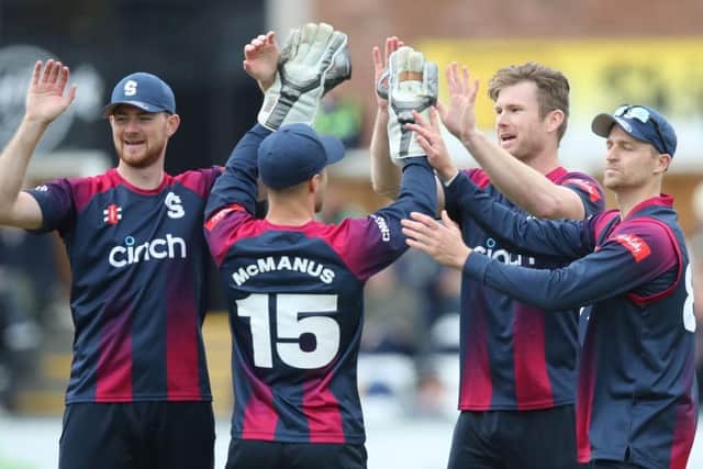 Jimmy Neesham is congratulated after after dismissing Durham's Ollie Robinson