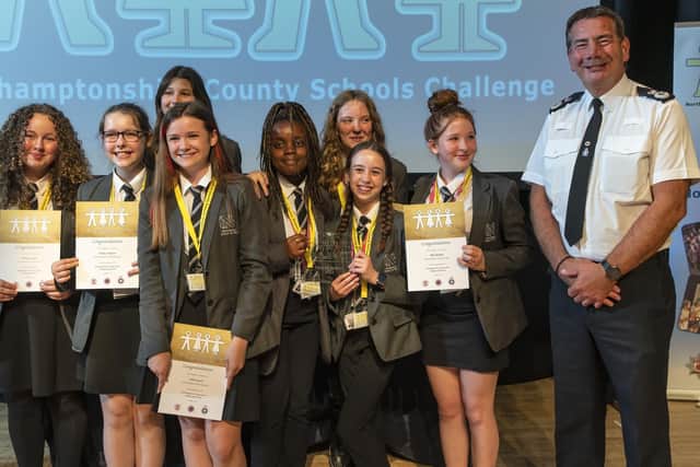 Chief Constable Nick Adderley with the winning NSG team