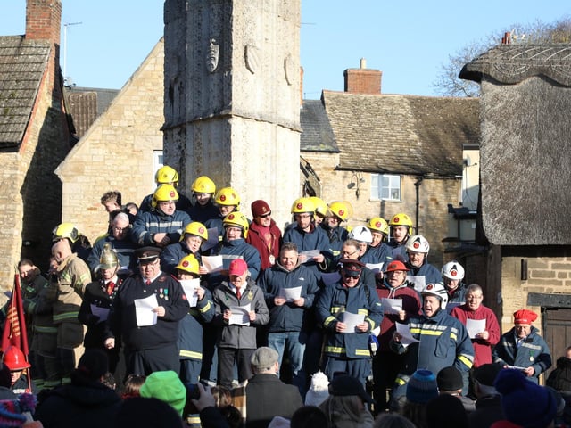 Geddington Volunteer Fire Brigade vs Northants Fire and Rescue firefighters at the annual Geddington Squirt
Singing at the Eleanor Cross