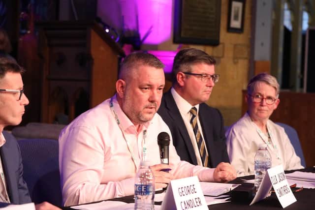Cllr Jason Smithers (with microphone)