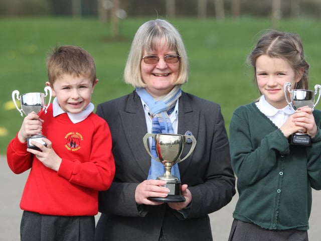 Headteacher of Rothwell Victoria County Infant School Christine Chittock with pupils Kyle Cossey (7) and Mia Diamond (7) who won trophies for spoken verse at Kettering Eistedfodd.