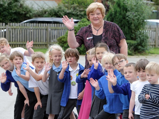 Corby Studfall Infants head teacher retires: Angela Brinkman, with children from every year of the school 2012