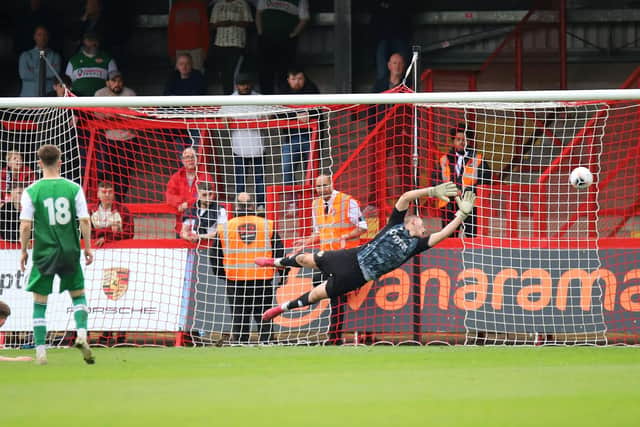 Joe Leesley's shot beats Owen Mason for Kidderminster's second goal