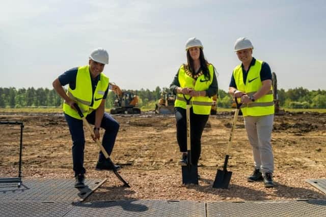 Nike operations and logistics vice president Eb Mukhtar with Corby mayor Leanne Buckingham and programme manager Jon Ford at this morning's sod cutting at Magna Park in Corby. Image: Nike