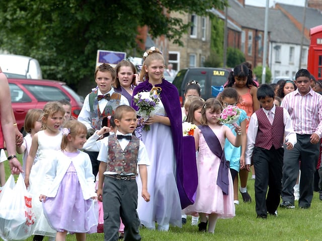 Woodford Primary School and Wellingborough Park Junior School.
May Queen Florence Whalley, 11, arrives at the village green 2007