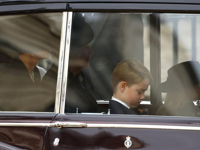 Camilla, Queen Consort, Catherine, Princess of Wales, Prince George and Princess Charlotte travel down The Mall