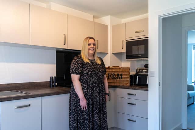 Priors Hall Park's 2000th new home buyer Jessica Sawford inside her new Davidsons Home