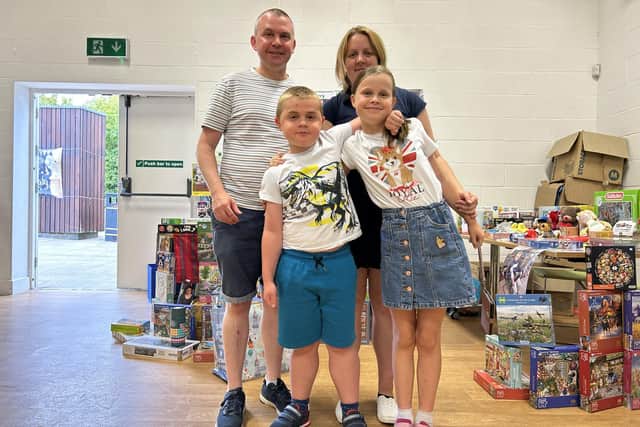 Harry and his family at their jigsaw stall
