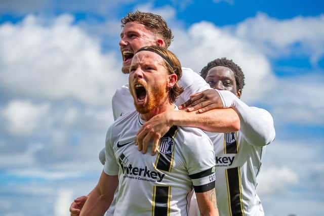 Jordon Crawford celebrates after scoring Corby Town's equaliser to make it 3-3 versus AFC Rushden & Diamonds (Picture: Jim Darrah)