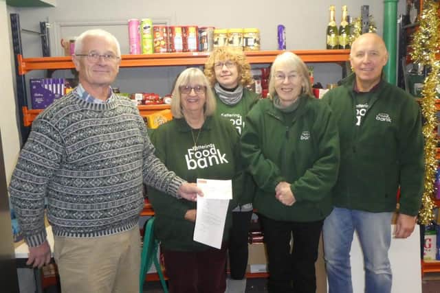 Local Choir present cheque to support Kettering Food Bank