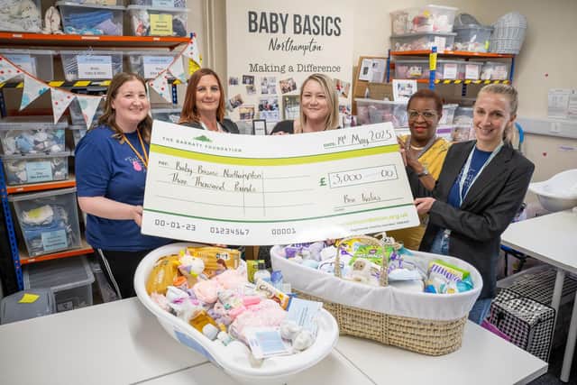Karen and Gemma presenting the cheque to the team at Baby Basics Northampton