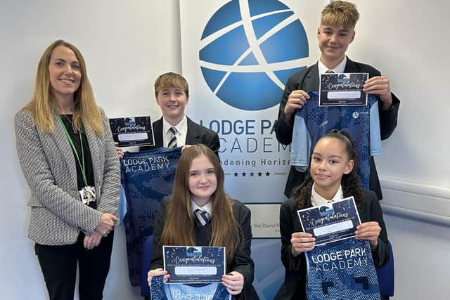 LPA Executive Principal Sue Jones with students and their new LPA Ravens kit. Image: DRET