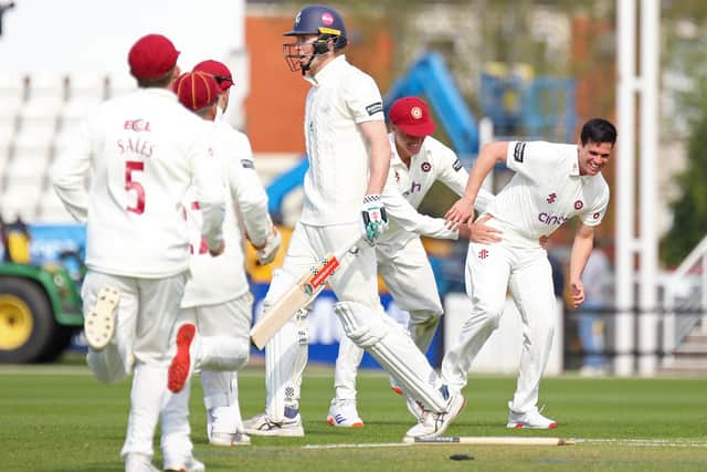Liam Guthrie (right) celebrates after claiming the wicket of Kent's England opener Zak Crawley (Picture: Peter Short)