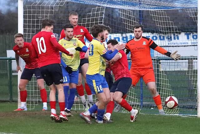 Will Jones is caught high and late on his ankle in the draw with St Neots Town (Picture: Phil Passingham)