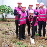 Crazy Hats founder Glennis Hooper pictured with representatives from Crazy Hats, Kettering General Hospital, Stepnell, and SCAPE, cutting the turf to start work on the new breast service lounge and waiting area (l-r) Crazy Hats representatives Phil and Jo Malone, Founder Glennis Hooper (with the spade) Stepnell MD Tom Wakefield, SCAPE Development Manager, Andrew Richman, KGH Director of Estates, Ian Allen, and KGH Consultant Onco-plastic Surgeon Mr Salam Musa.)