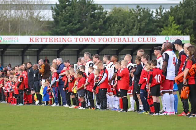 The players line up ahead of the Legends Match at Latimer Park